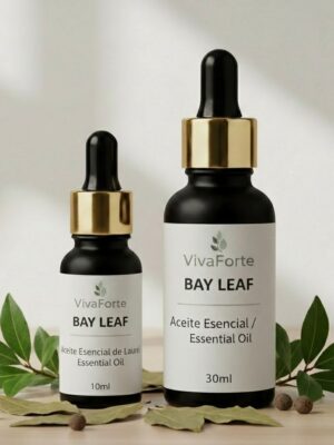 Two premium matte black glass bottles with luxury gold-rimmed pipettes. The label reads "BAY LEAF." Fresh and dried laurel leaves are artistically arranged on a light wooden surface with soft shadows.